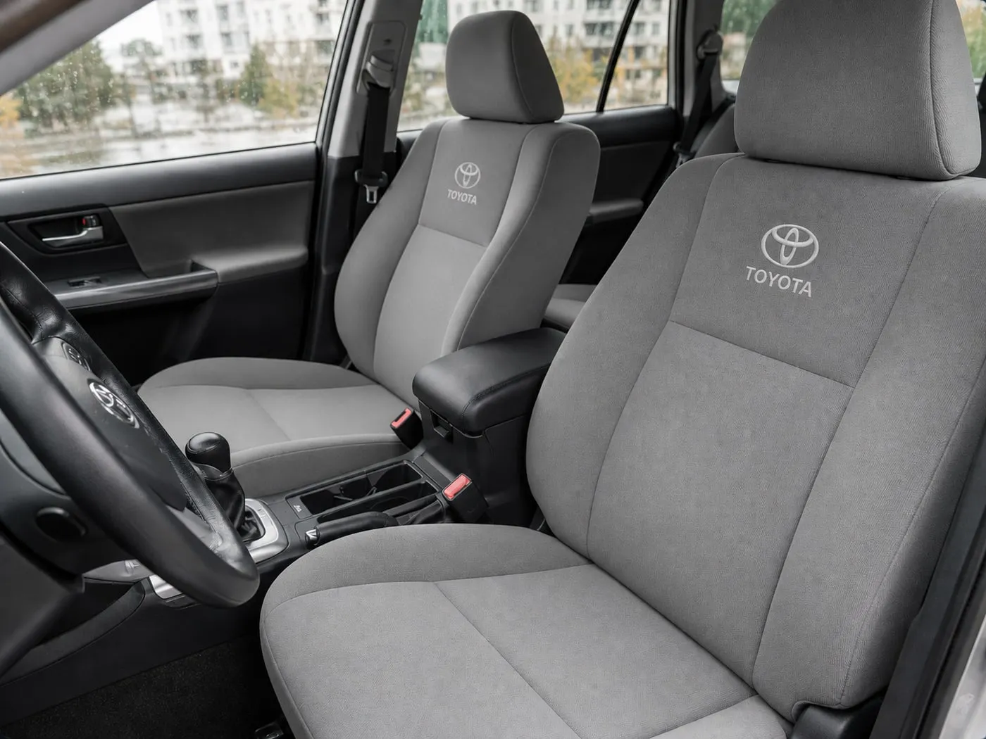 The same Toyota front seats after steam cleaning, the grey fabric even and clean